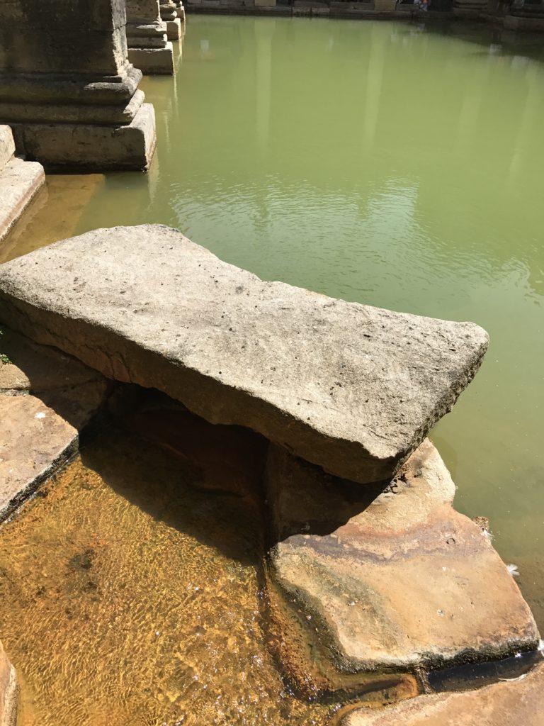 This is the 'diving stone' of the Great Bath. Not a good idea to dive in though; the water's only about five feet deep