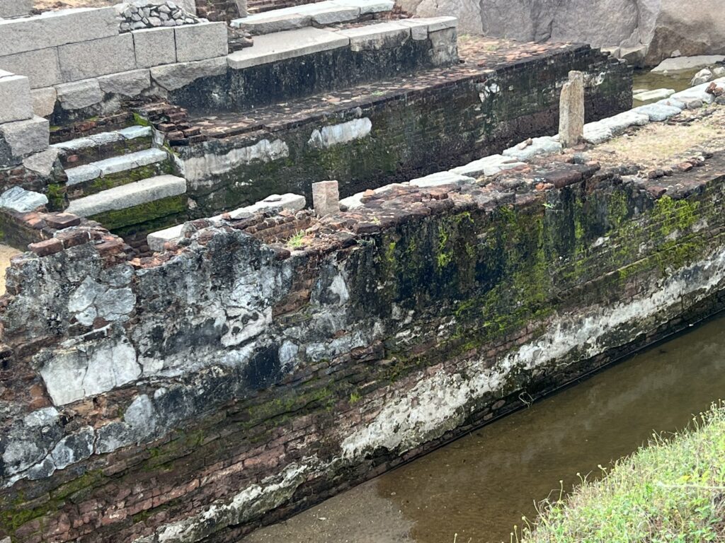 The brick and mortar foundations of a stone temple show that stone building came later in ancient India.