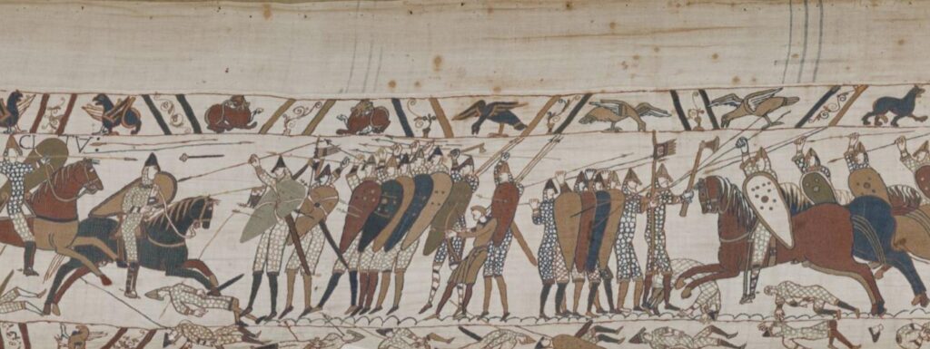 English soldiers grouped together in the Battle of Hastings in the Bayeux Tapestry, as Norman arrows fall around them.