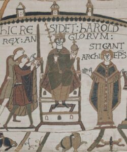 Harold being crowned king of England after Edward the Confessor's death. This is a scene from the Bayeux Tapestry.